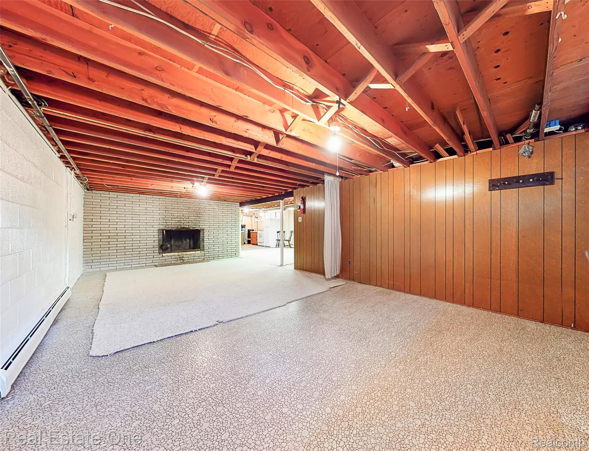 5360 Greenfield Road Brighton, MI 48114 - Photo 32 of 44 Large open area with natural fireplace.
