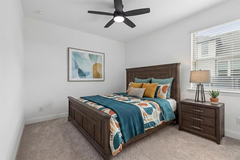 4933 Switchback Street Little Elm, TX 76227 - Photo 17 of 33 Secondary bedroom 4 is located separate from all other bedrooms and is ensuite, a perfect guest bedroom or in-law suite.