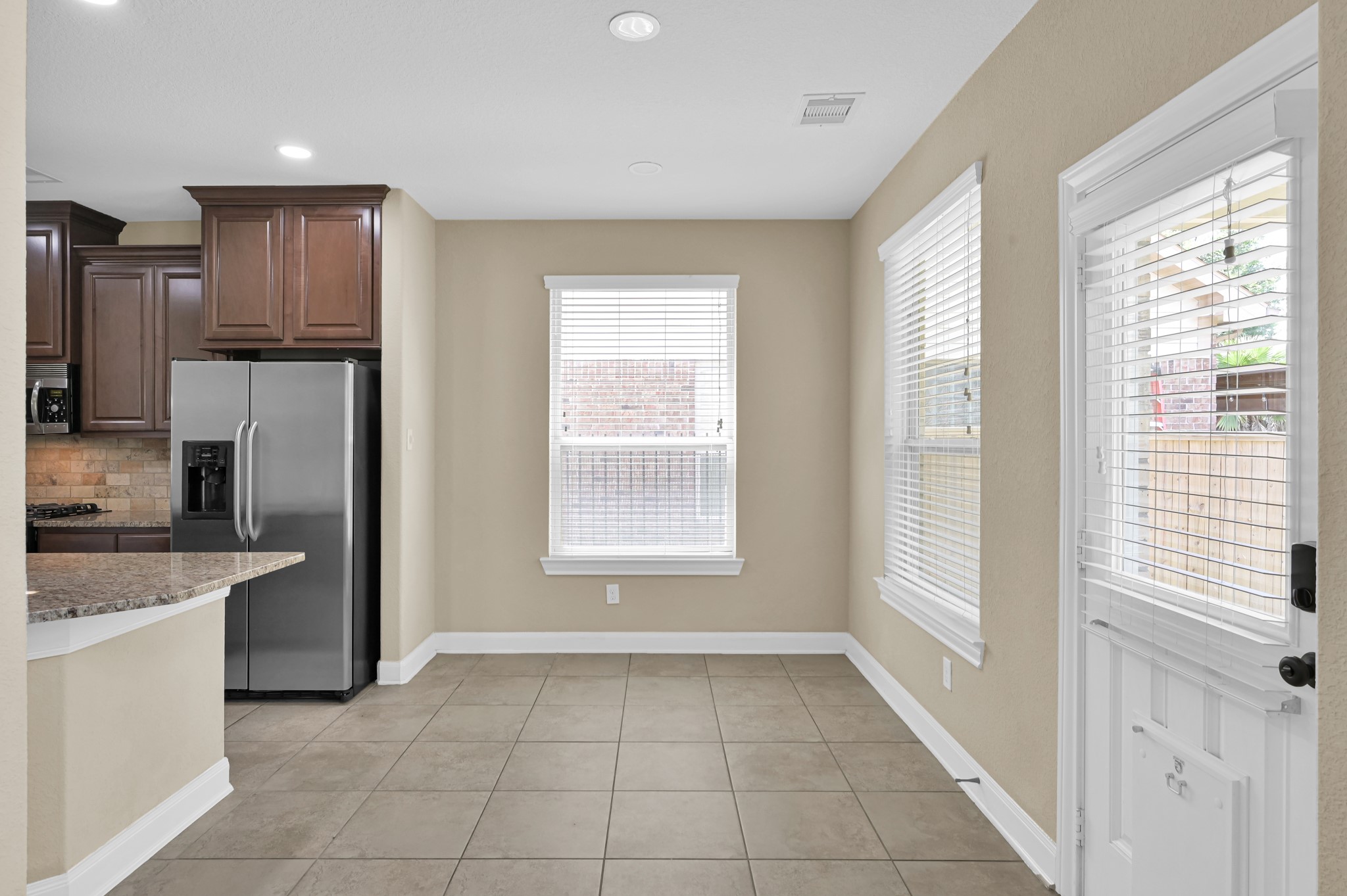 106 North Pinto Point Circle Spring, TX 77389 - Photo 11 of 39 a view of a kitchen with a sink dishwasher and a refrigerator