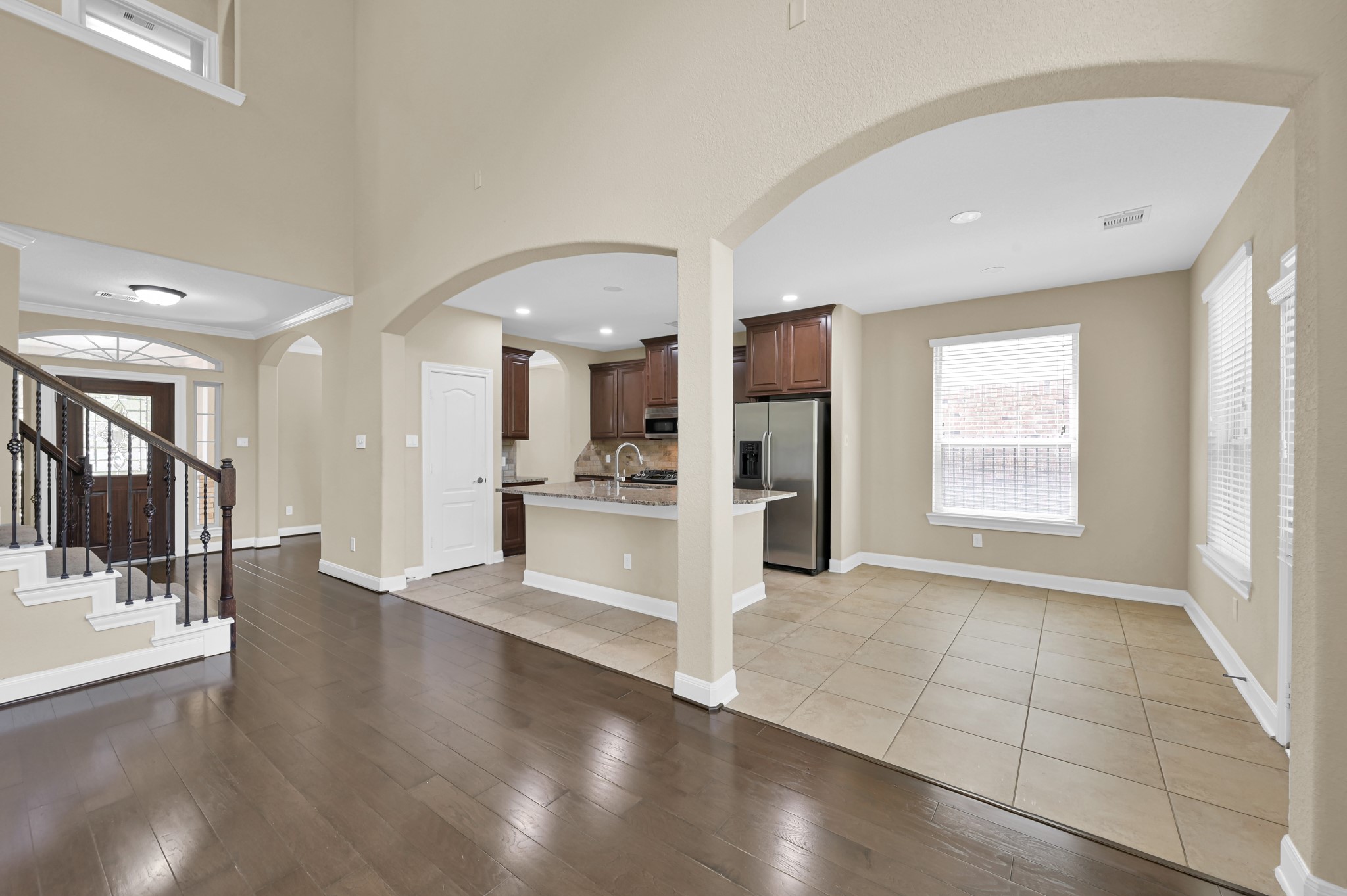 106 North Pinto Point Circle Spring, TX 77389 - Photo 12 of 39 a view of a kitchen with refrigerator and wooden floor