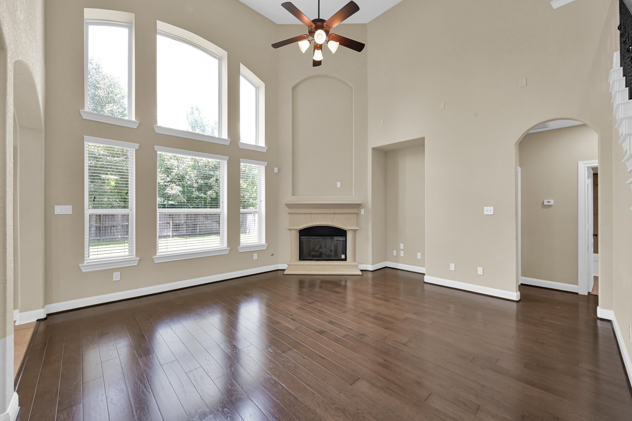 106 North Pinto Point Circle Spring, TX 77389 - Photo 14 of 39 a view of an empty room with window and wooden floor