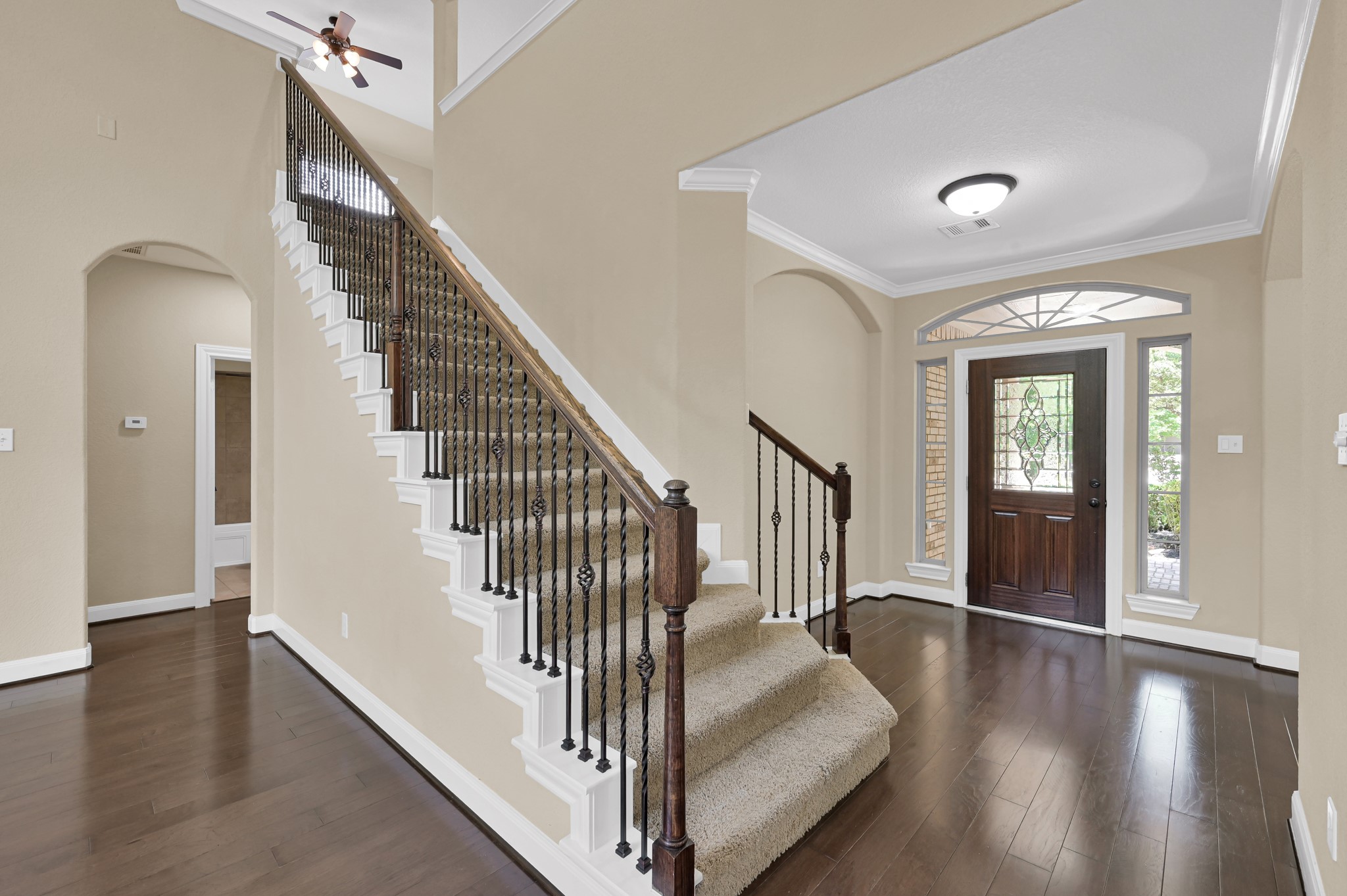 106 North Pinto Point Circle Spring, TX 77389 - Photo 21 of 39 a view of a hallway with wooden floor and stairs