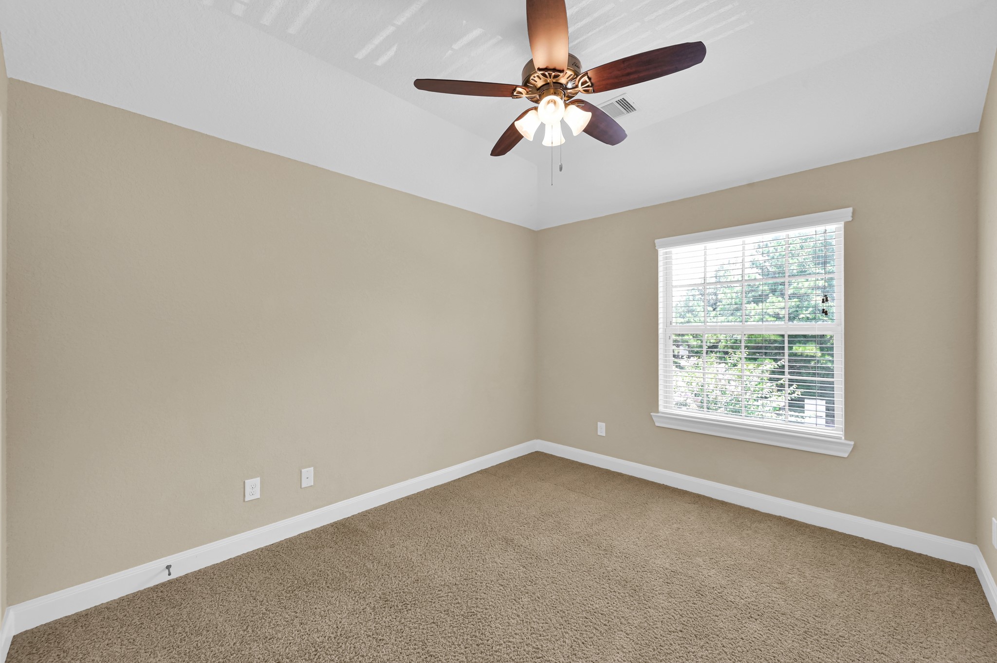 106 North Pinto Point Circle Spring, TX 77389 - Photo 25 of 39 an empty room with a window and a fan