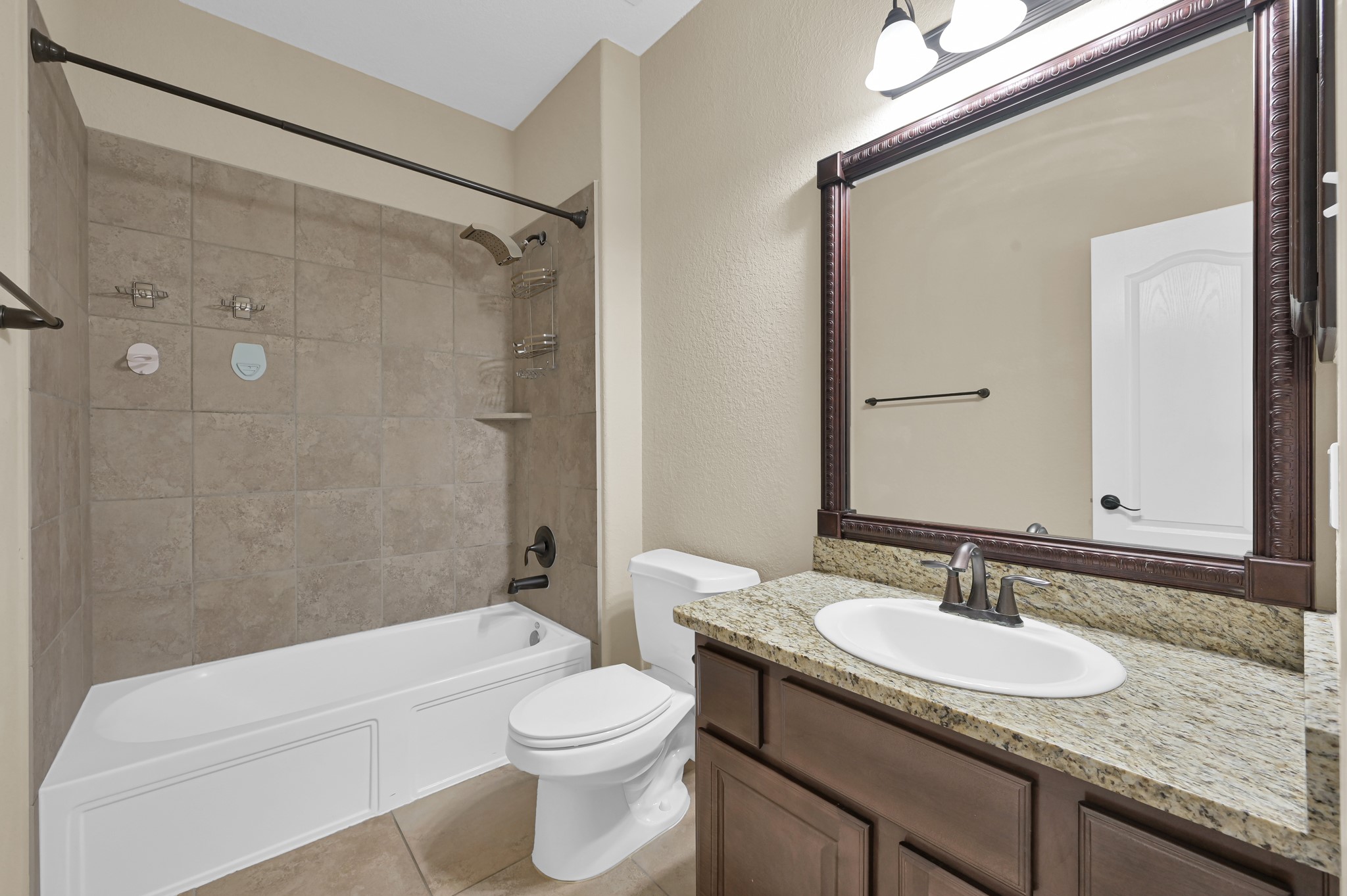 106 North Pinto Point Circle Spring, TX 77389 - Photo 27 of 39 a bathroom with a granite countertop sink toilet and shower