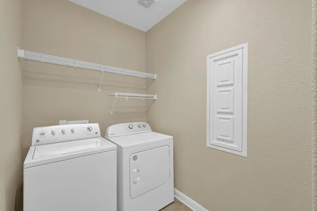 a utility room with dryer and washer