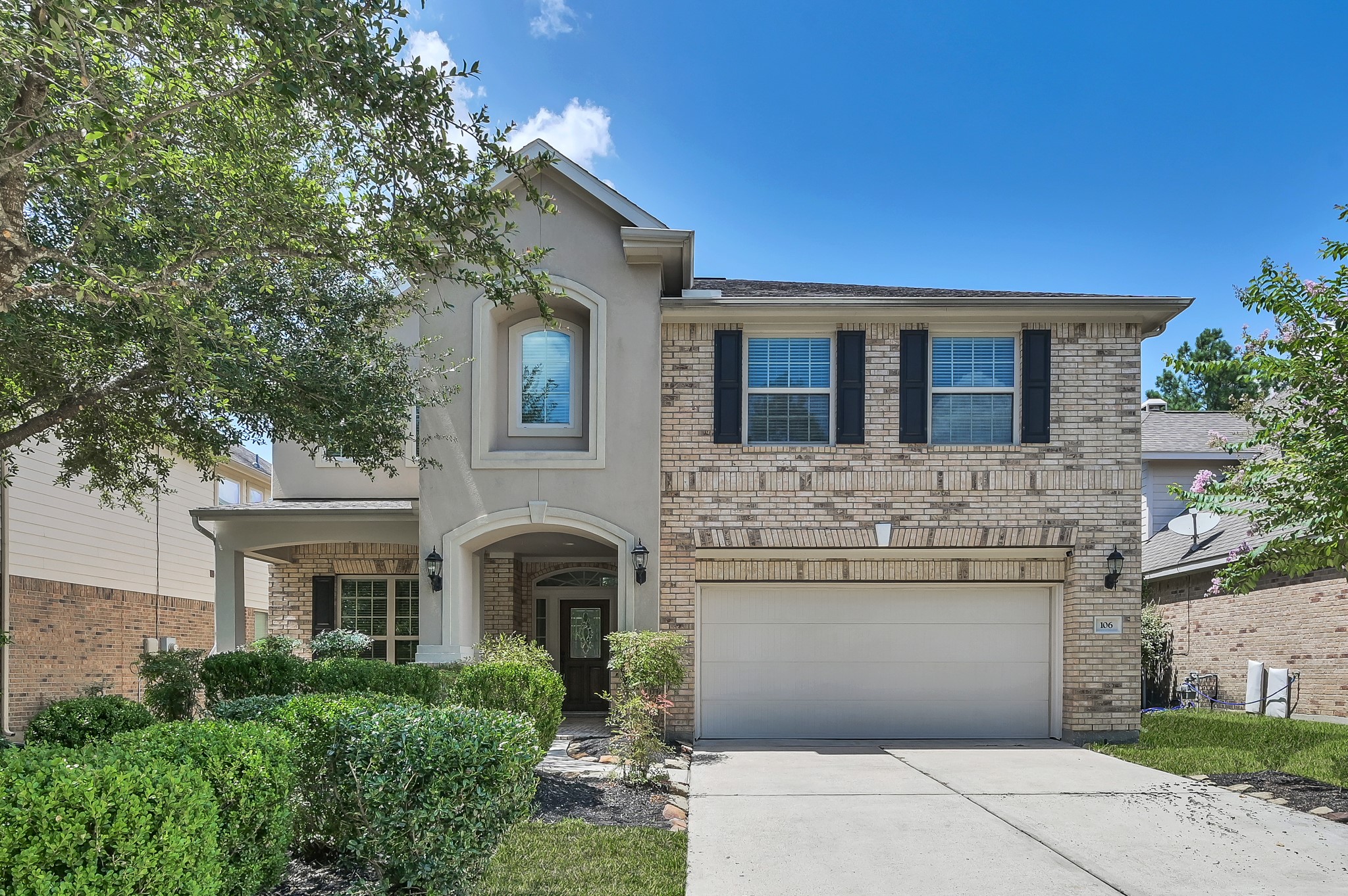 106 North Pinto Point Circle Spring, TX 77389 - Photo 38 of 39 a front view of a house with a garden