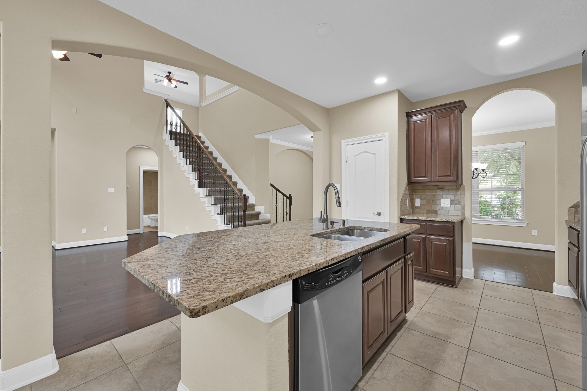 106 North Pinto Point Circle Spring, TX 77389 - Photo 9 of 39 a kitchen with a stove a sink a refrigerator and chairs
