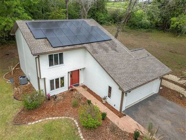 an aerial view of a house having yard