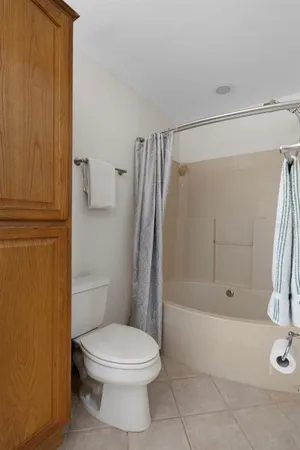 a bathroom with a sink toilet and a mirror