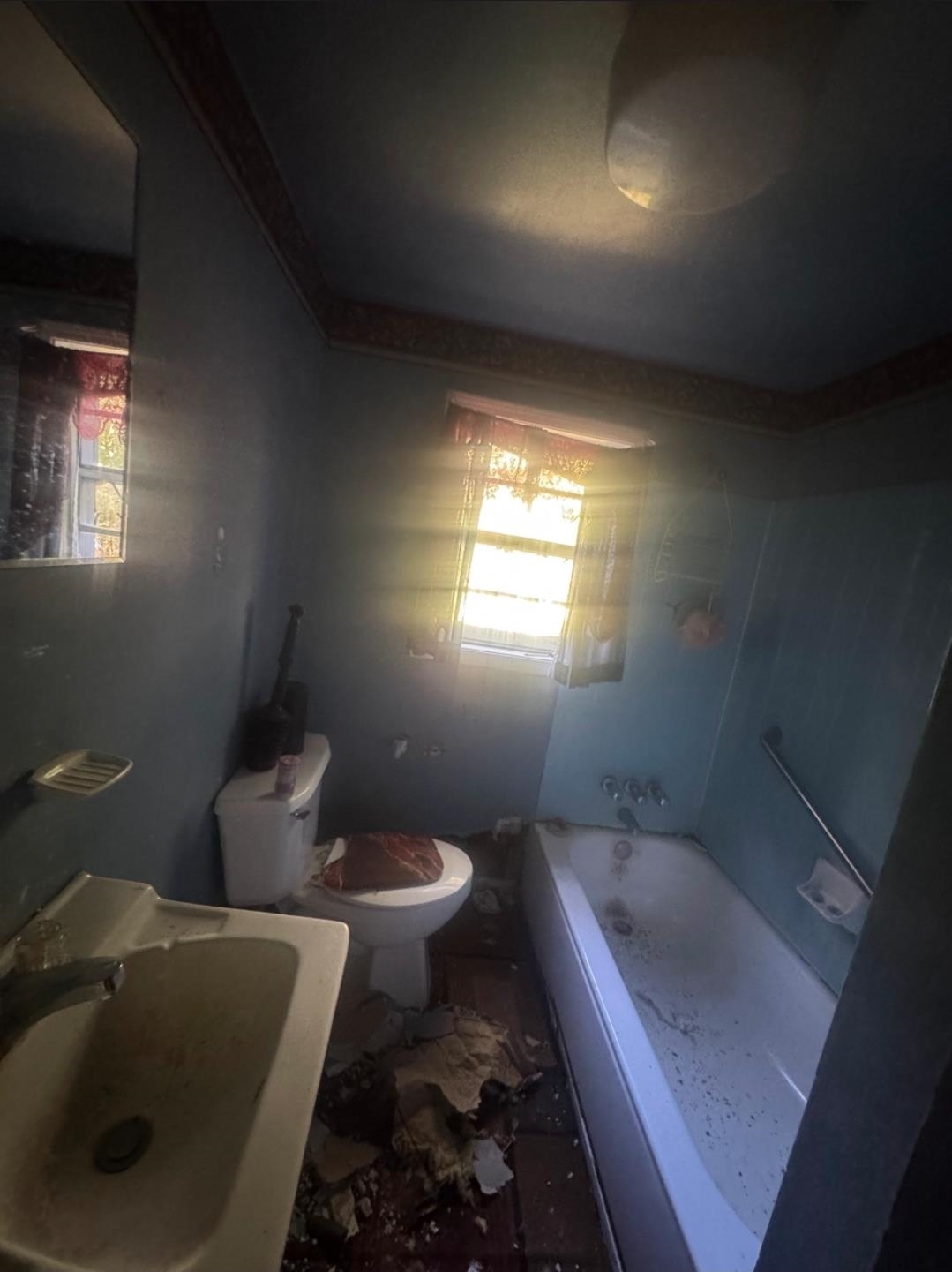 1719 Fields Road Memphis, TN 38109 - Photo 4 of 10 a bathroom with a toilet sink and mirror