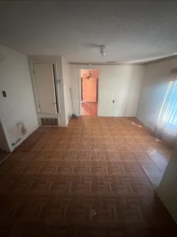 a view of an empty room and window