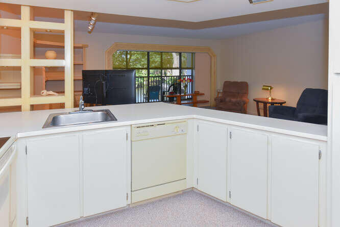 1605 Highway 1, Unit C203 Jupiter, FL 33477 - Photo 16 of 31 a room with dryer and washer