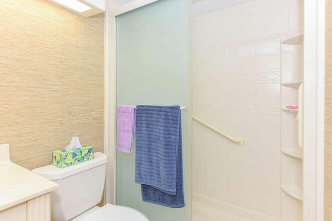 1605 Highway 1, Unit C203 Jupiter, FL 33477 - Photo 21 of 31 a bathroom with a toilet and shower