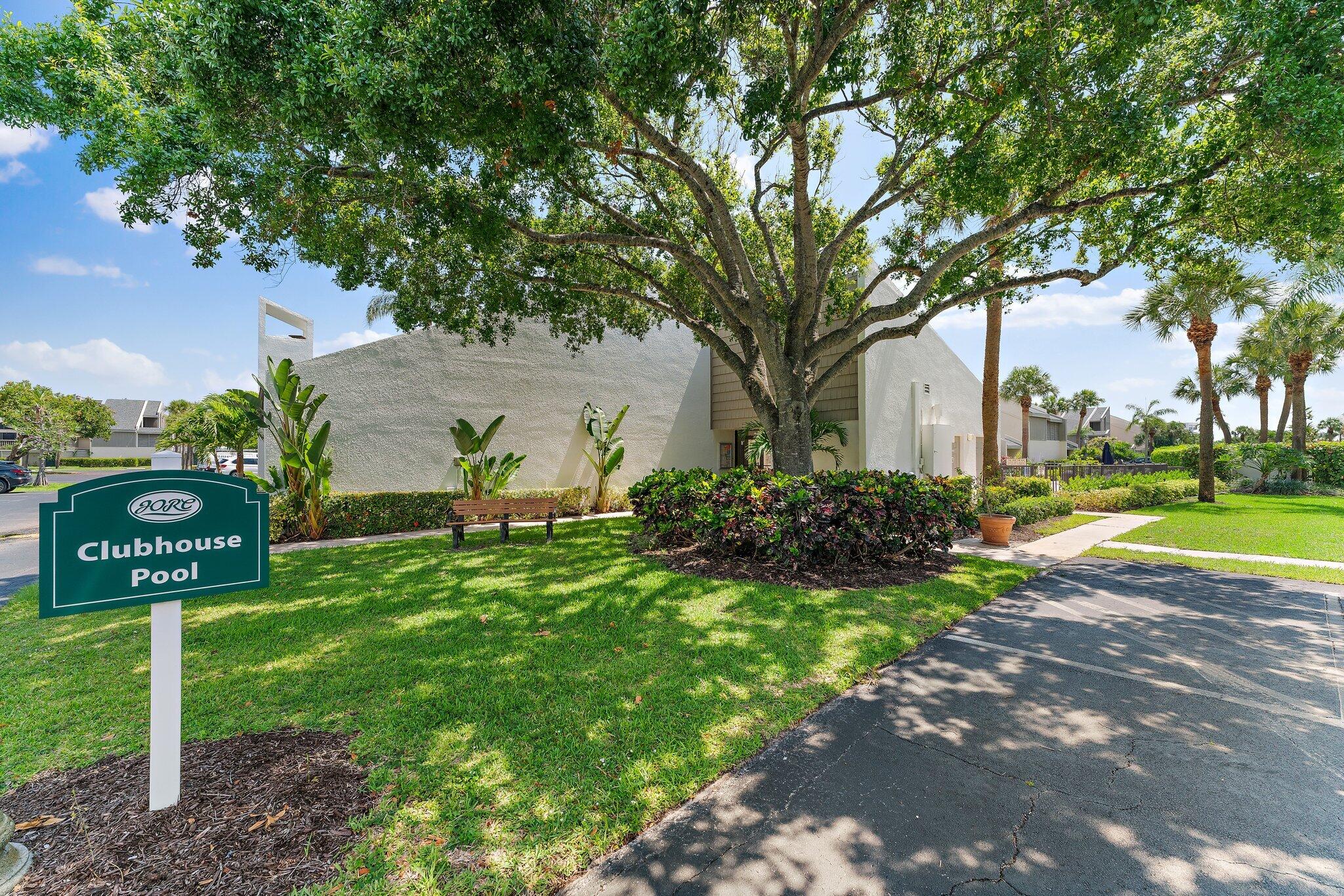 1605 Highway 1, Unit C203 Jupiter, FL 33477 - Photo 27 of 31 a view of a street with large trees