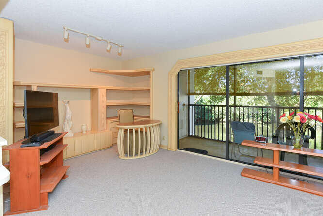 1605 Highway 1, Unit C203 Jupiter, FL 33477 - Photo 8 of 31 a view of livingroom with furniture and windows