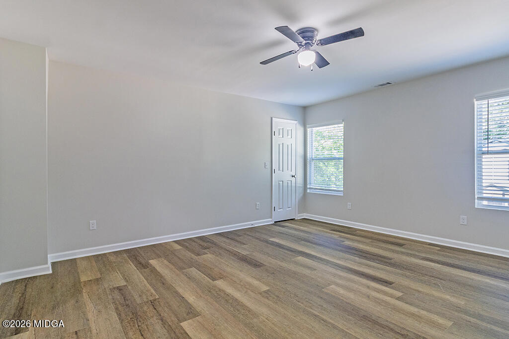 114 Emily Street Macon, GA 31204 - Photo 17 of 21 wooden floor in an empty room with a window