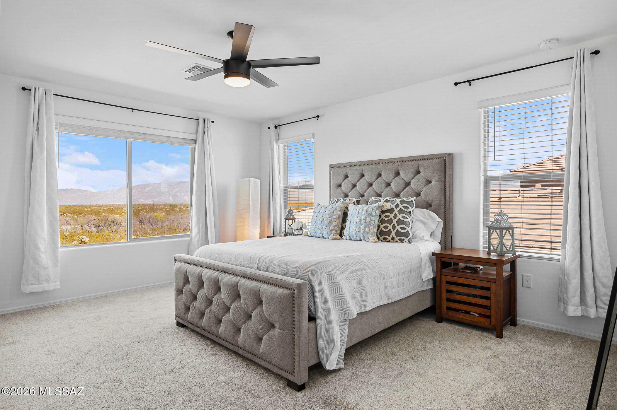 12092 East Ryscott Circle Vail, AZ 85641 - Photo 28 of 49 a bed sitting in a spacious bedroom next to a window