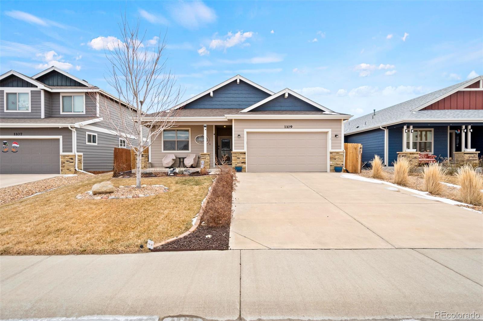 1109 Bison Way Wiggins, CO 80654 - Photo 3 of 33 a front view of a house with a yard
