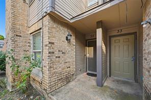 8001 Rothington Road, Unit 3137 Dallas, TX 75227 - Photo 7 of 21 Exterior featuring a brick facade, siding accents, an overhead entry canopy, and a paneled entry door