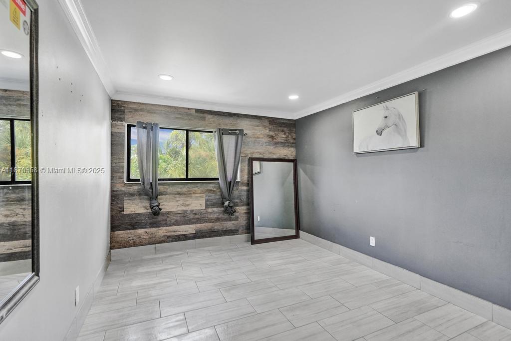 900 Crystal Lake Drive, Unit 2B Deerfield Beach, FL 33073 - Photo 11 of 41 a view of an empty room with a window