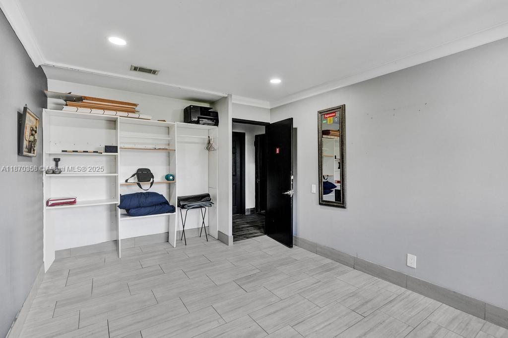 900 Crystal Lake Drive, Unit 2B Deerfield Beach, FL 33073 - Photo 13 of 41 a view of work space with cabinets