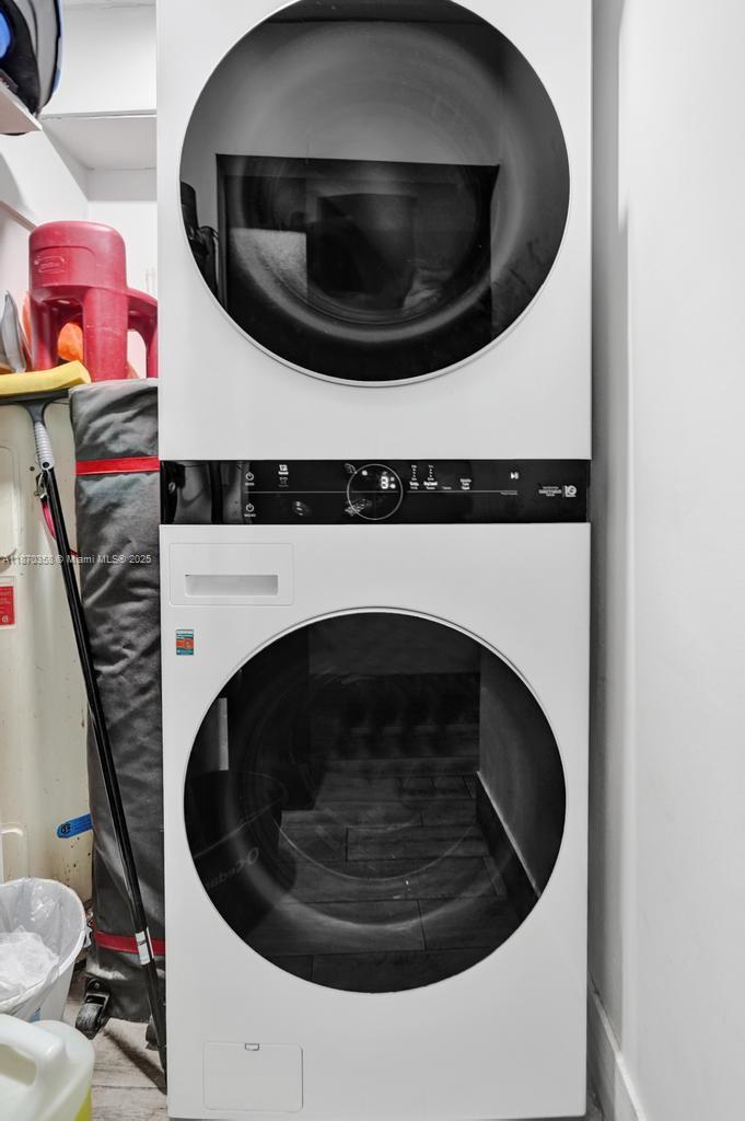 900 Crystal Lake Drive, Unit 2B Deerfield Beach, FL 33073 - Photo 26 of 41 a utility room with dryer and washer