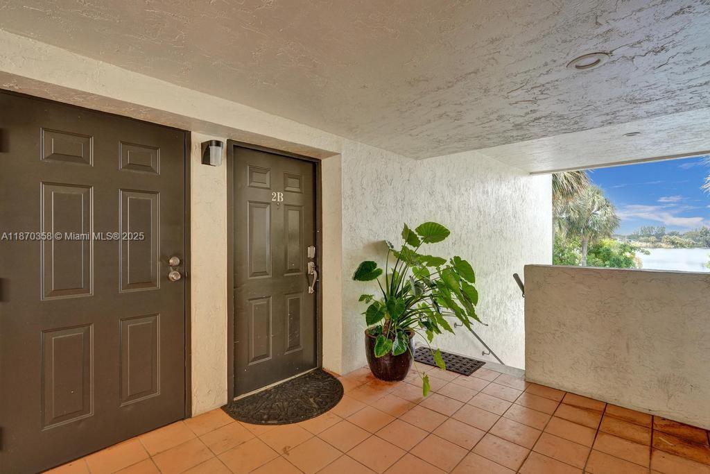 900 Crystal Lake Drive, Unit 2B Deerfield Beach, FL 33073 - Photo 38 of 41 a view of a entryway door front of house