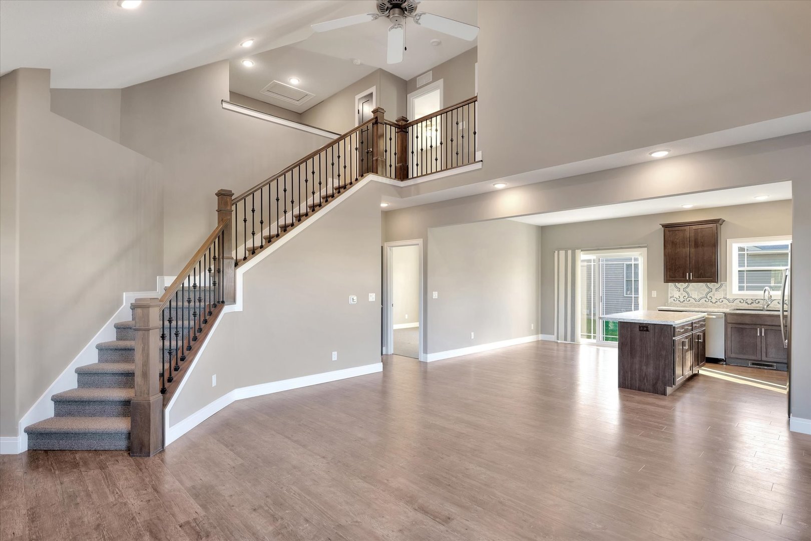 3402 Boulder Ridge Drive Champaign, IL 61822 - Photo 20 of 42 a view of staircase and kitchen with wooden floor