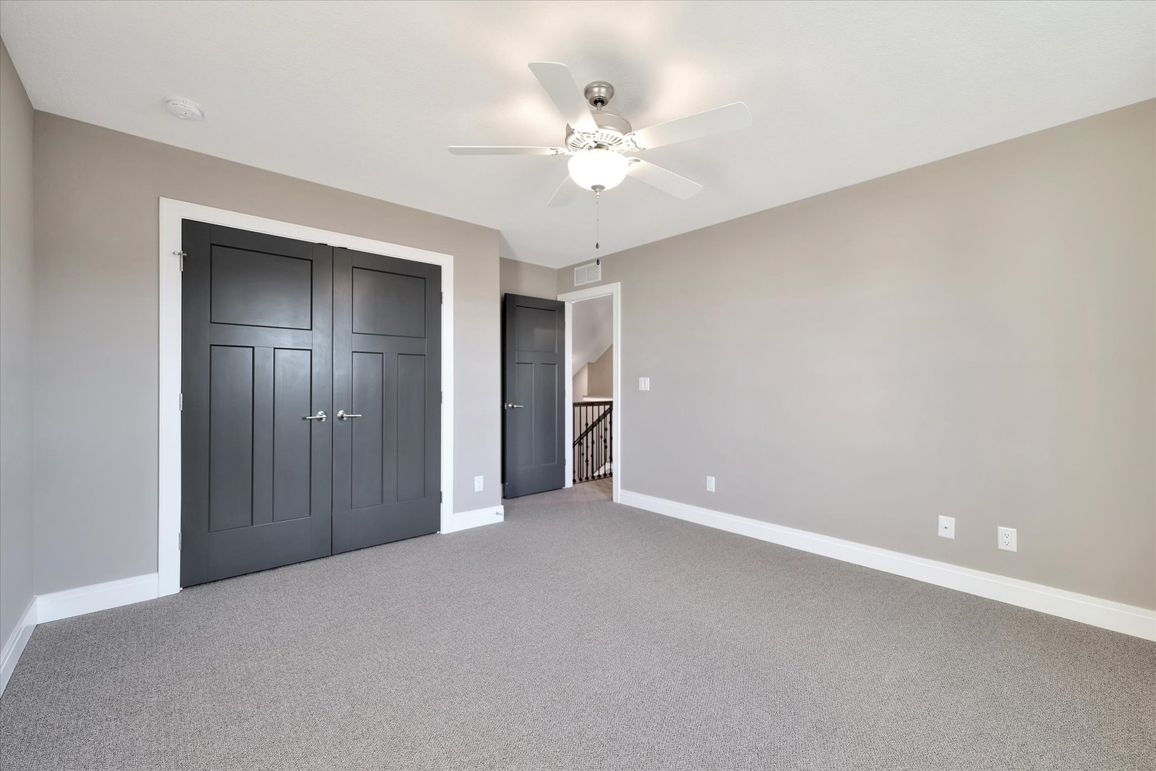 3402 Boulder Ridge Drive Champaign, IL 61822 - Photo 29 of 42 a view of an empty room with a chandelier fan