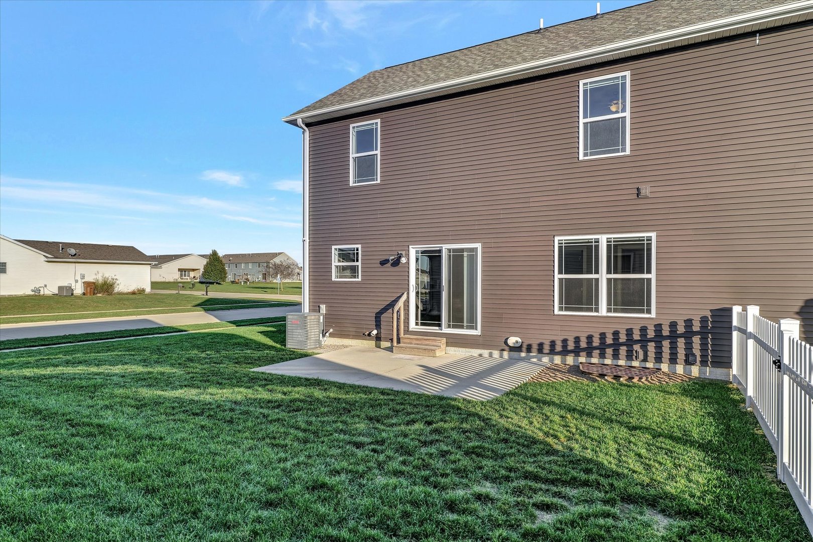 3402 Boulder Ridge Drive Champaign, IL 61822 - Photo 36 of 42 a front view of a house with a yard
