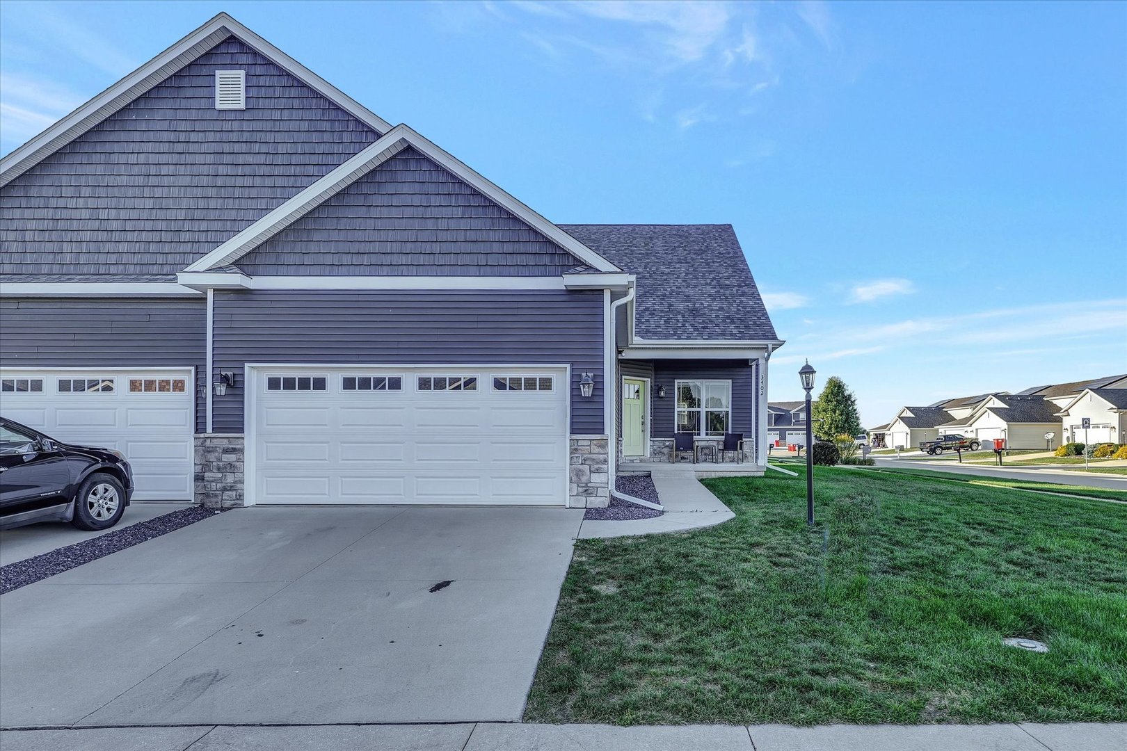 3402 Boulder Ridge Drive Champaign, IL 61822 - Photo 40 of 42 a view of a house with a yard