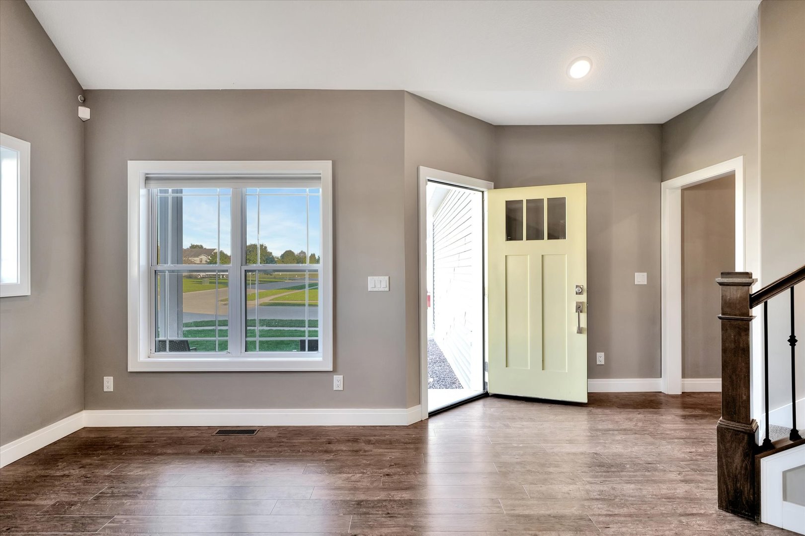 3402 Boulder Ridge Drive Champaign, IL 61822 - Photo 4 of 42 an empty room with large window and wooden floor