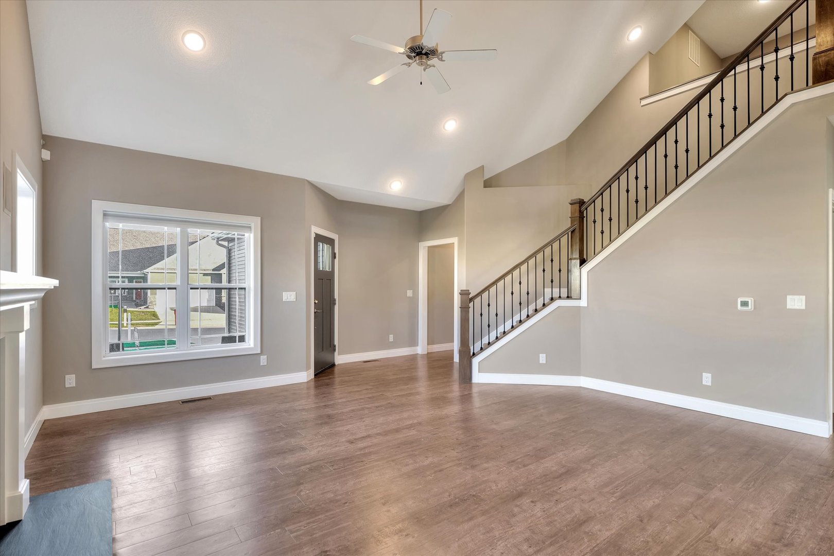 3402 Boulder Ridge Drive Champaign, IL 61822 - Photo 5 of 42 a view of an entryway with wooden floor and windows