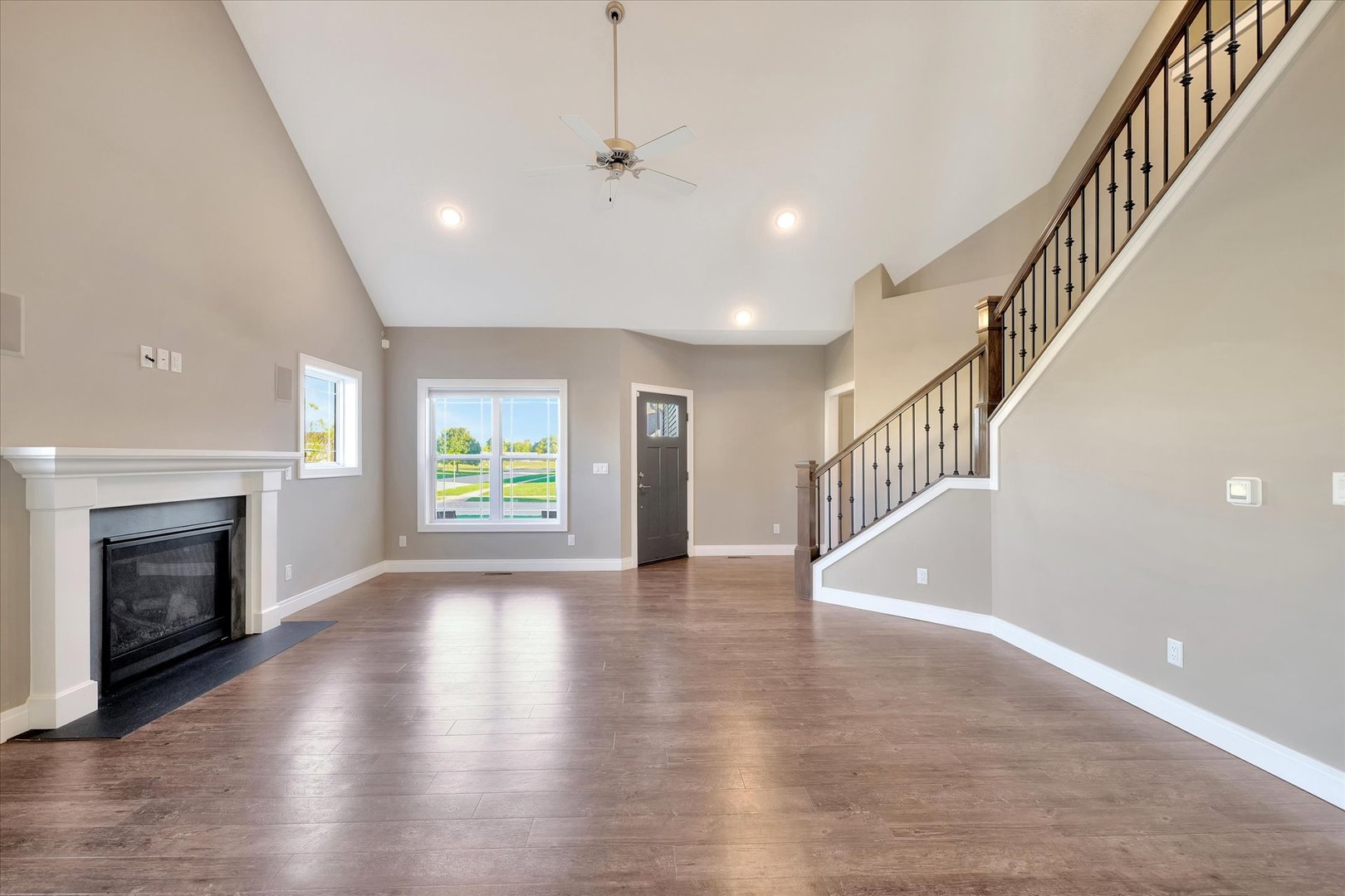 3402 Boulder Ridge Drive Champaign, IL 61822 - Photo 6 of 42 a view of an empty room with wooden floor fireplace and a window