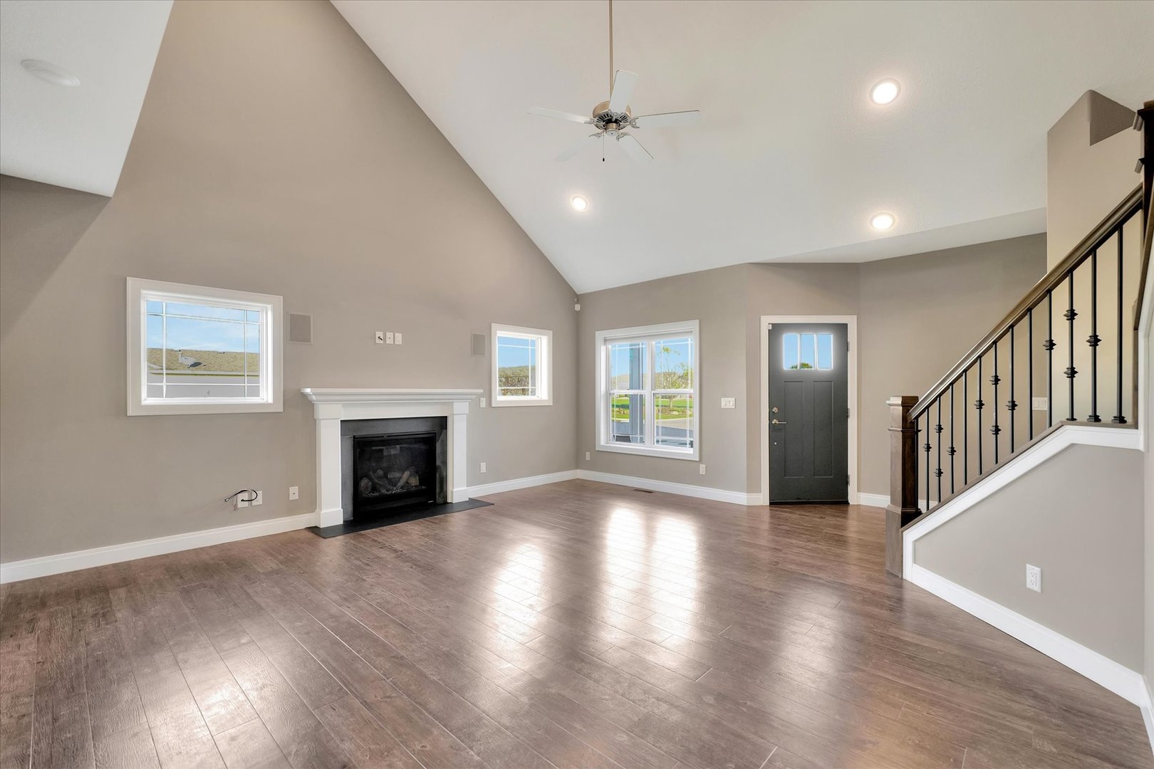 3402 Boulder Ridge Drive Champaign, IL 61822 - Photo 7 of 42 a view of an empty room with wooden floor fireplace and a window