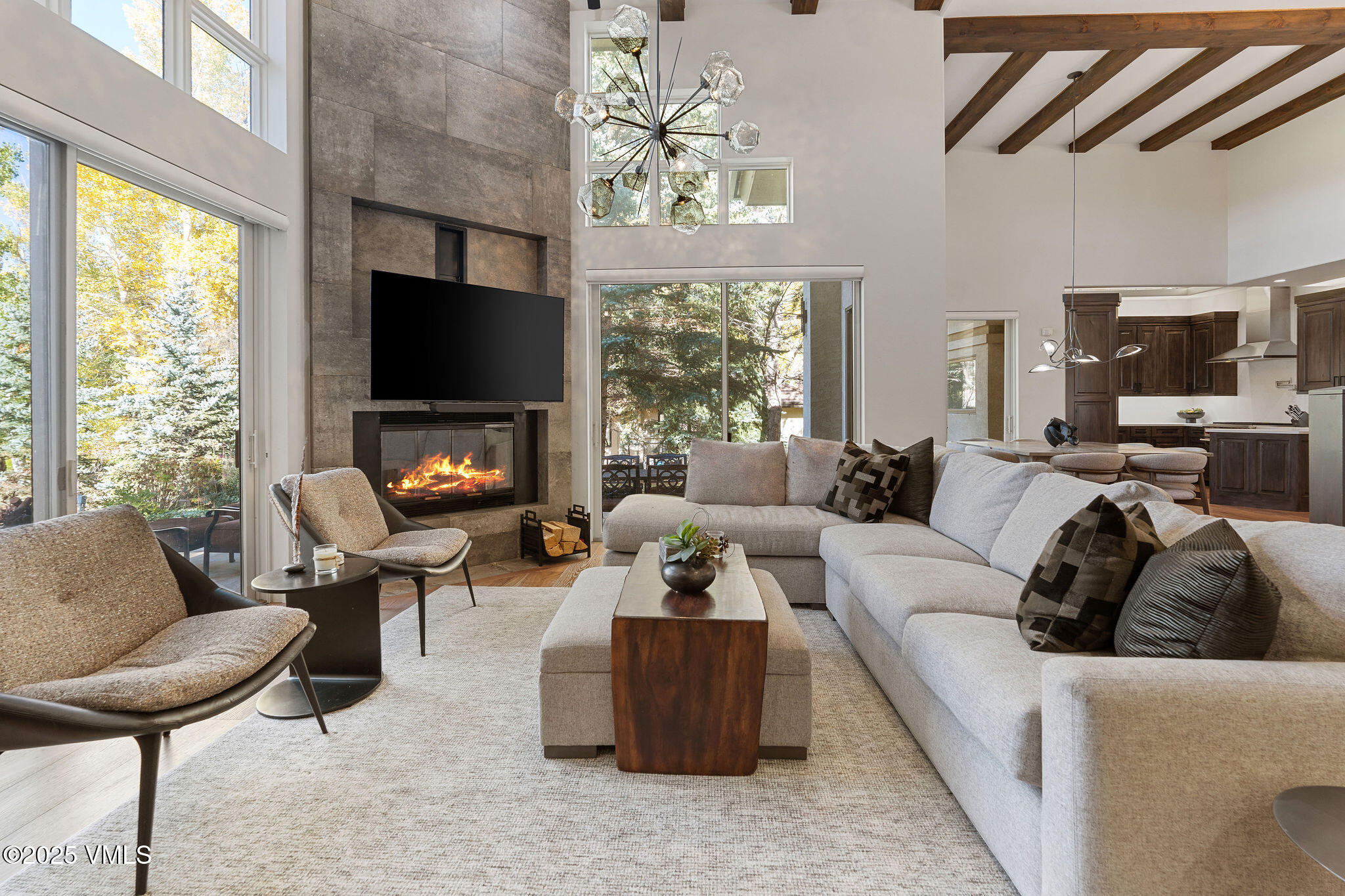 150 Sawatch Drive Edwards, CO 81632 - Photo 1 of 34 a living room with furniture a flat screen tv and a fireplace