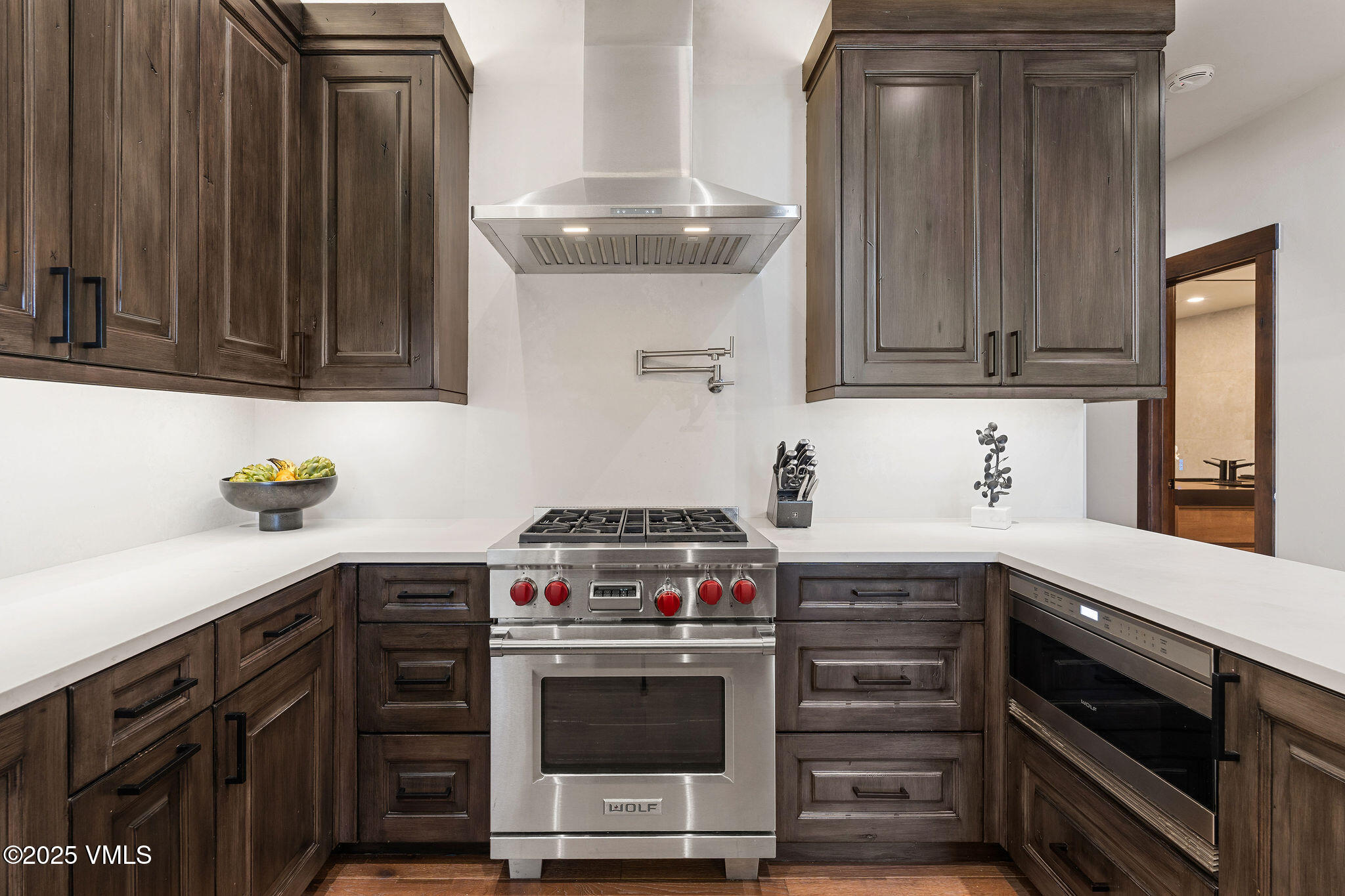 150 Sawatch Drive Edwards, CO 81632 - Photo 12 of 34 a kitchen with stainless steel appliances wooden cabinets and a stove top oven