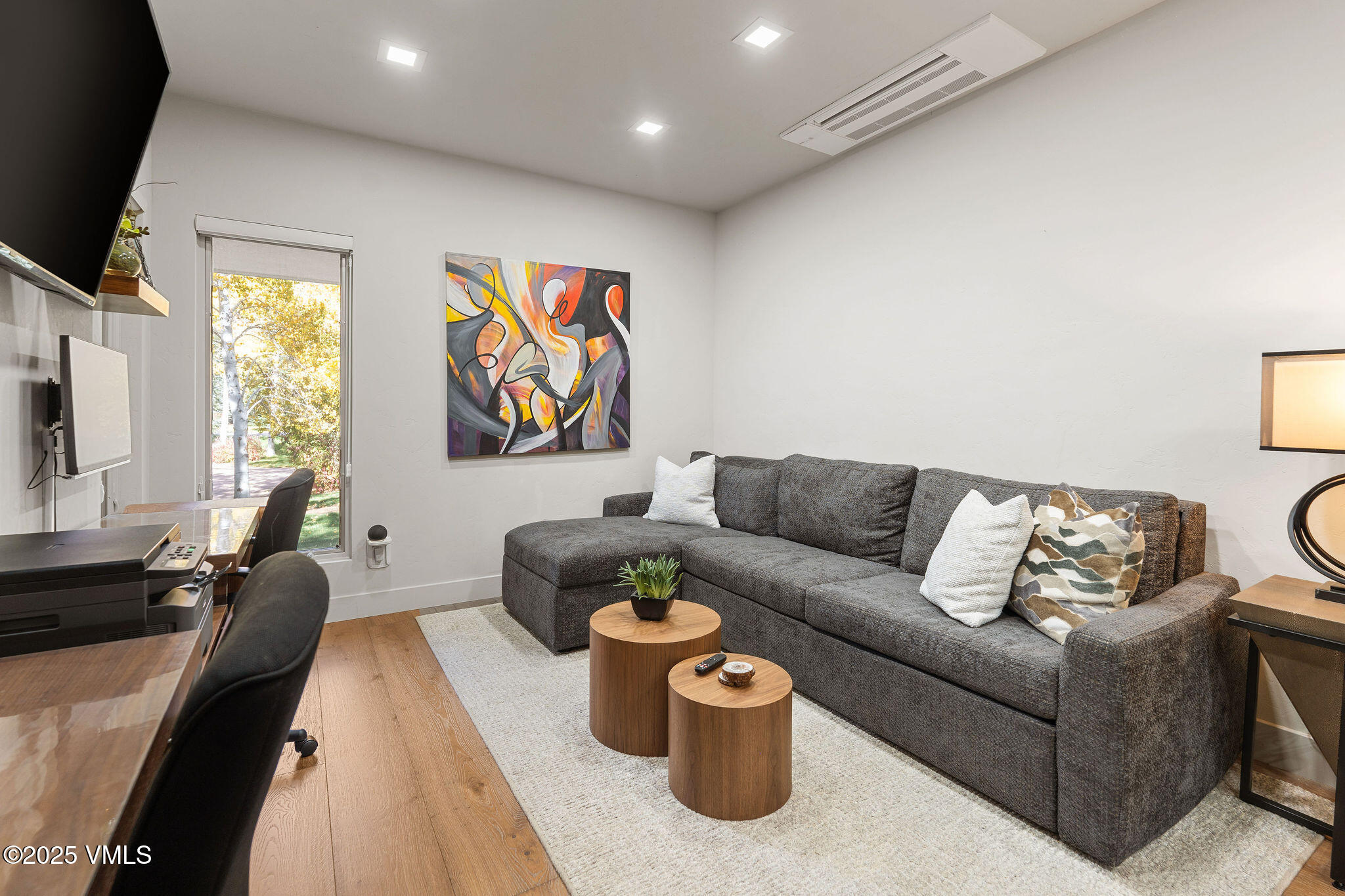 150 Sawatch Drive Edwards, CO 81632 - Photo 28 of 34 a living room with furniture and a flat screen tv
