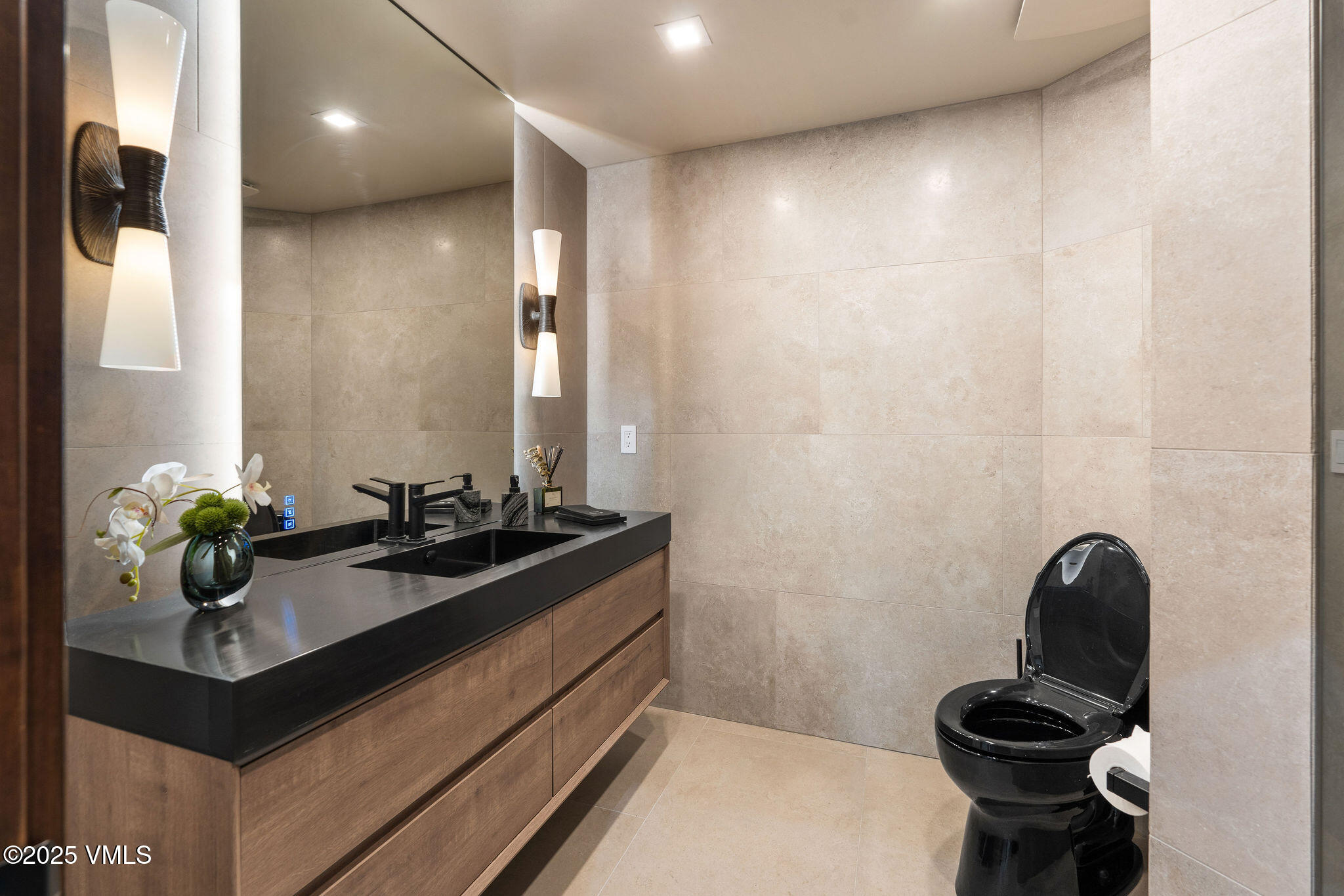 150 Sawatch Drive Edwards, CO 81632 - Photo 29 of 34 a bathroom with a sink and a mirror