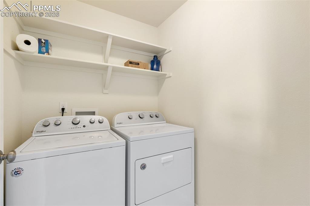 7678 Dutch Loop Colorado Springs, CO 80925 - Photo 11 of 29 a utility room with dryer and washer