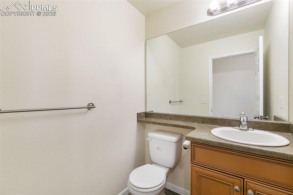 7678 Dutch Loop Colorado Springs, CO 80925 - Photo 12 of 29 a bathroom with a sink toilet and shower