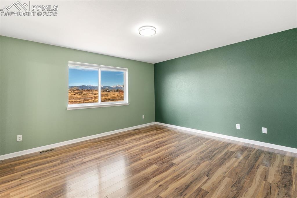 7678 Dutch Loop Colorado Springs, CO 80925 - Photo 13 of 29 a view of room with window and ceiling fan