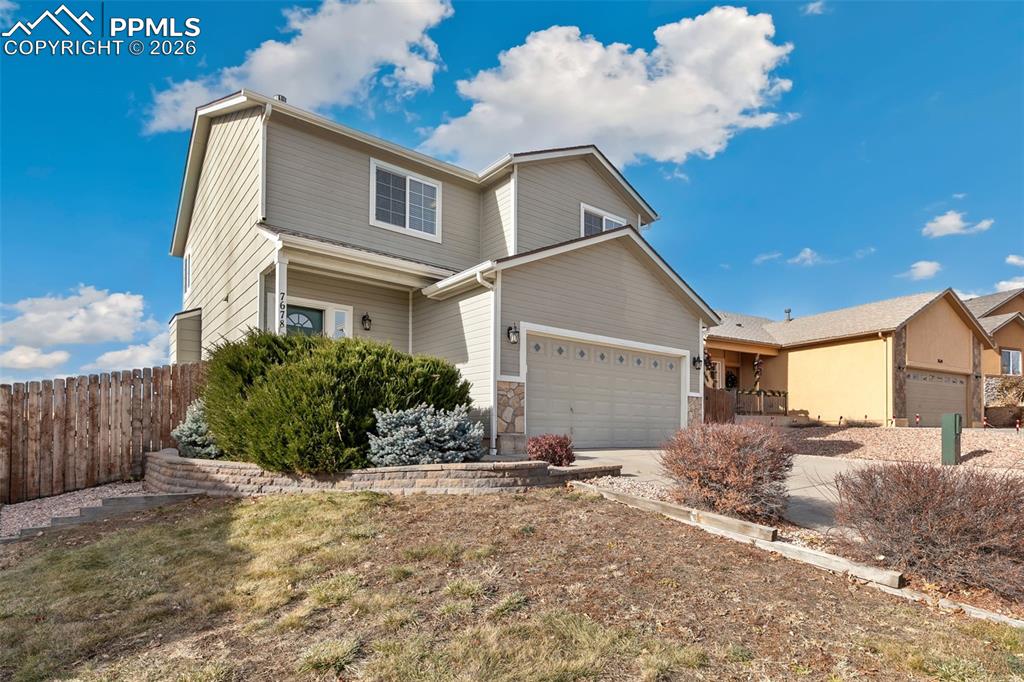 7678 Dutch Loop Colorado Springs, CO 80925 - Photo 2 of 29 a view of a house with a yard