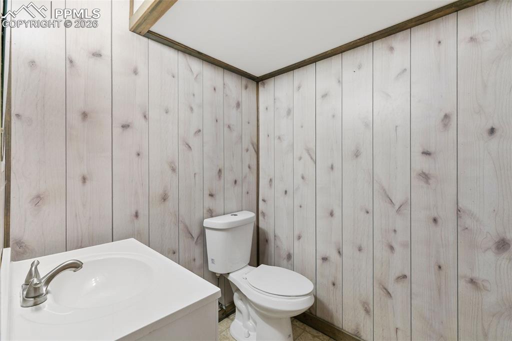 7678 Dutch Loop Colorado Springs, CO 80925 - Photo 26 of 29 a bathroom with a sink a toilet and shower
