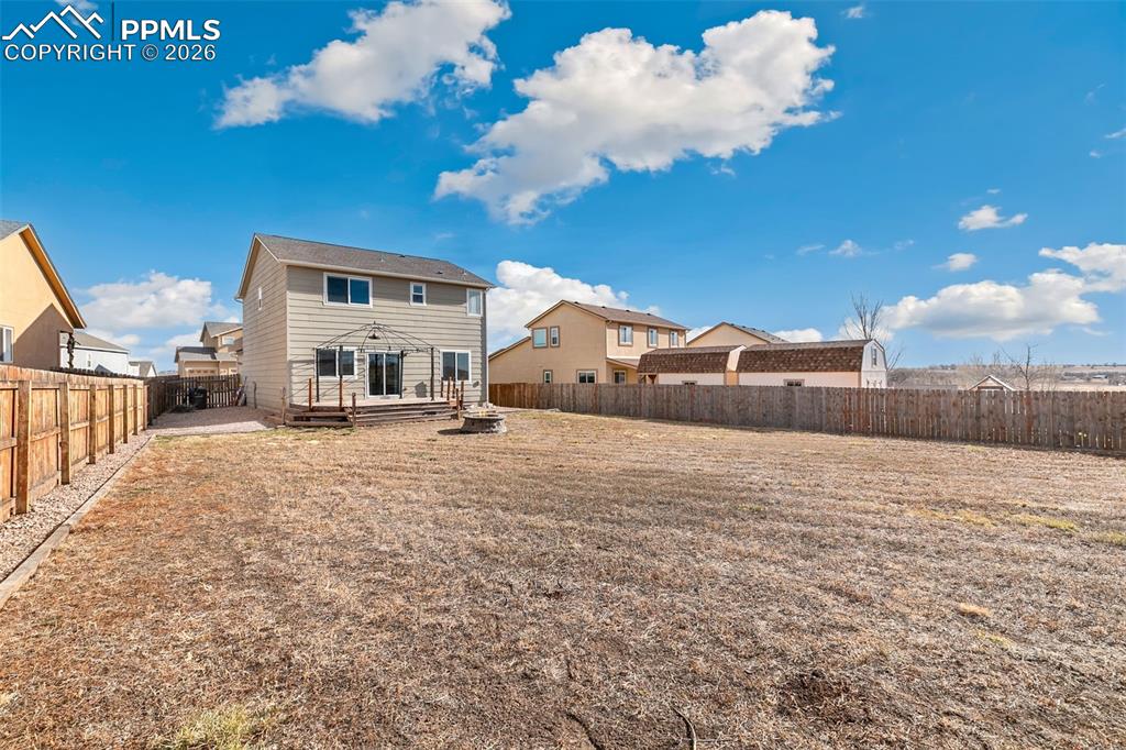 7678 Dutch Loop Colorado Springs, CO 80925 - Photo 29 of 29 a view of a house next to a big yard