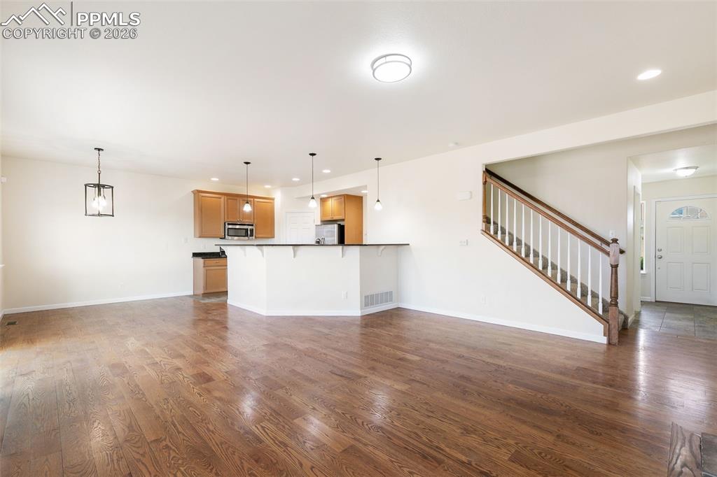 7678 Dutch Loop Colorado Springs, CO 80925 - Photo 6 of 29 a view of a kitchen with wooden floor