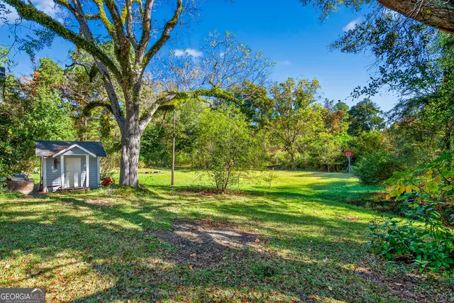 a backyard of a house with lots of green space