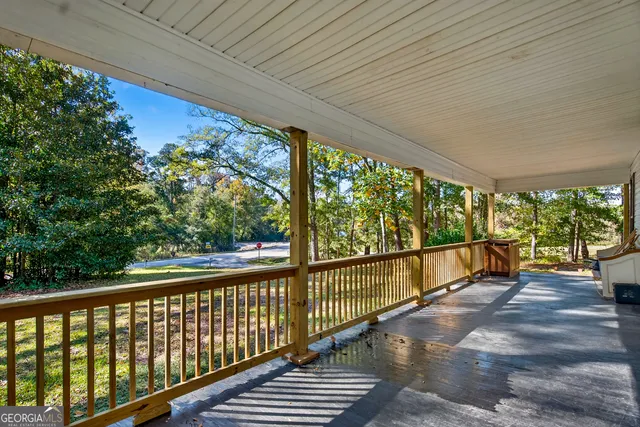 a view of two chairs in the balcony