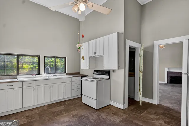 a kitchen with stainless steel appliances a stove a sink and a refrigerator