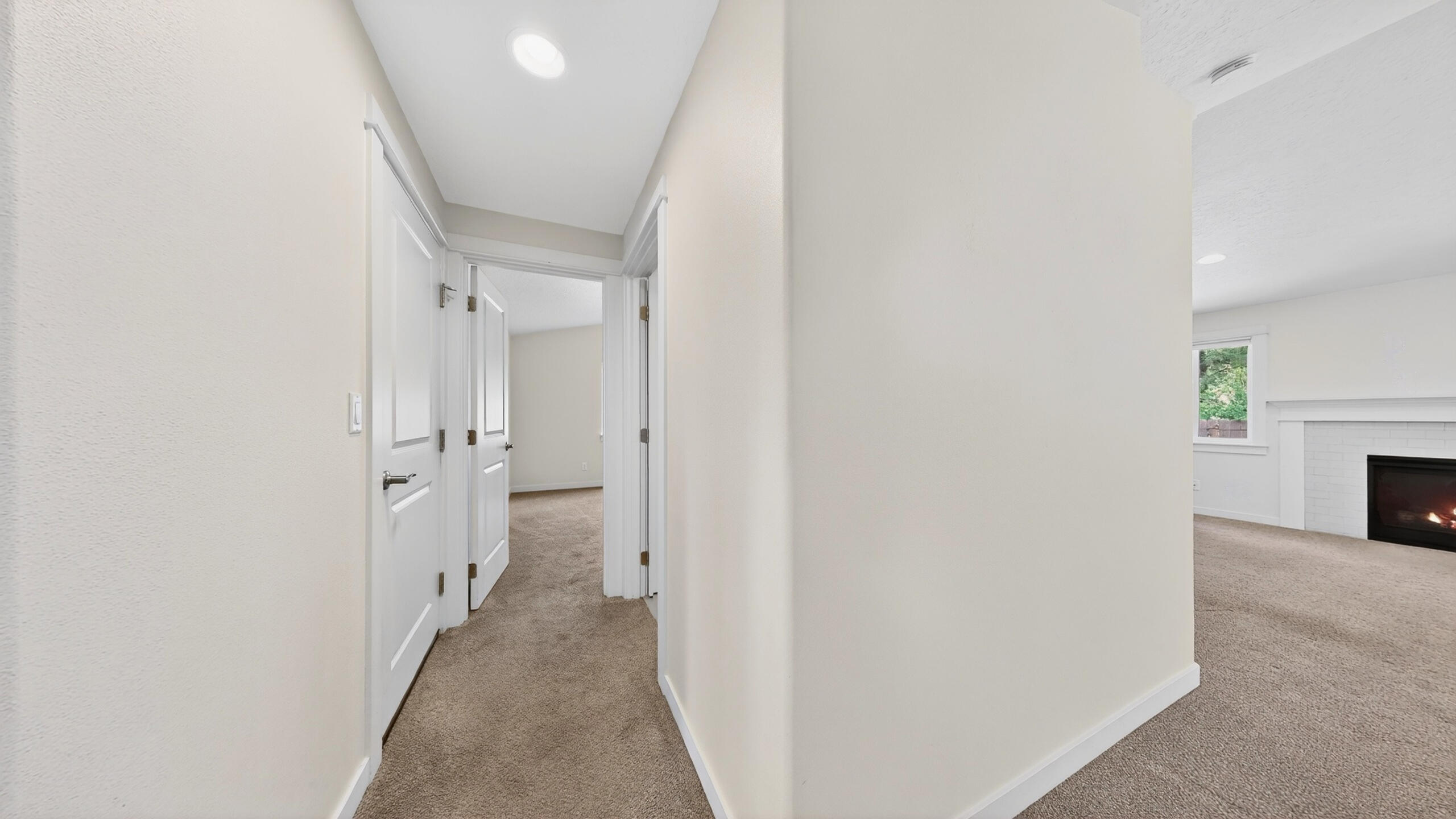 680 McKinney Ranch Road Sisters, OR 97759 - Photo 24 of 41 a view of a hallway with a fireplace